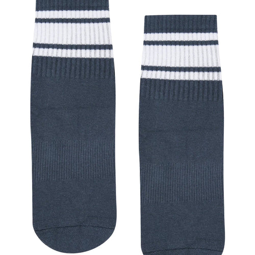 Pair of navy blue socks with white stripes on a white background
