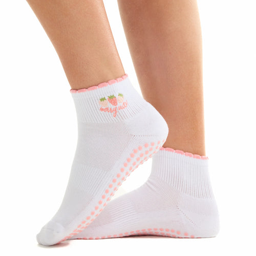 White socks with pink trim worn by a person on a white background