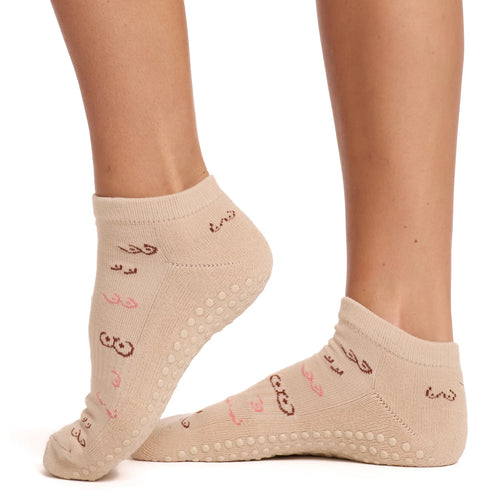 Beige socks with text and patterns on a white background