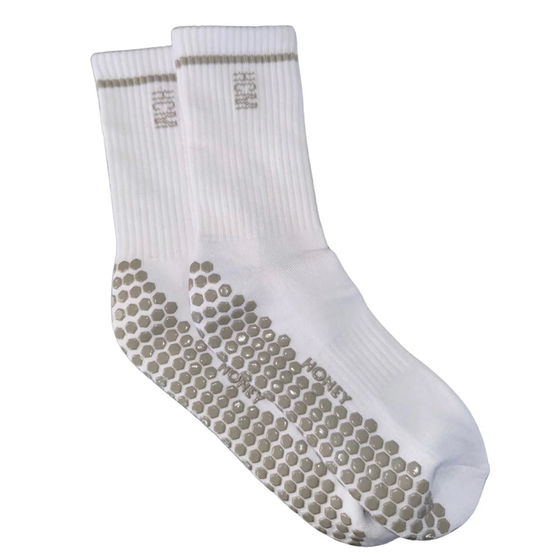 White socks with textured sole on a white background