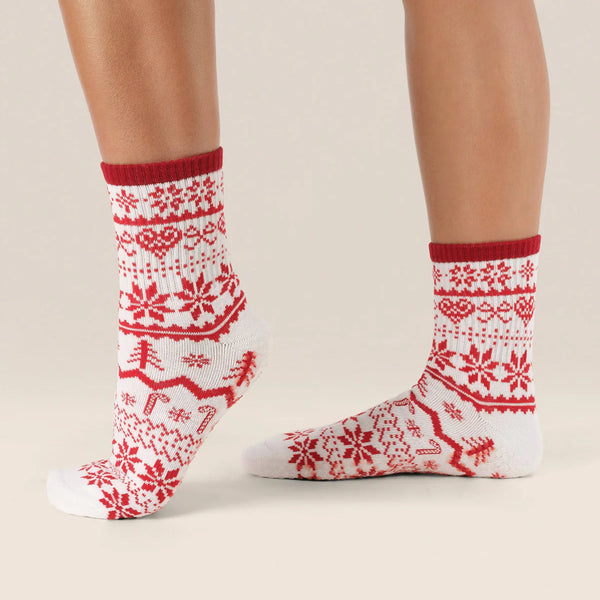 Red and white patterned socks on a neutral background