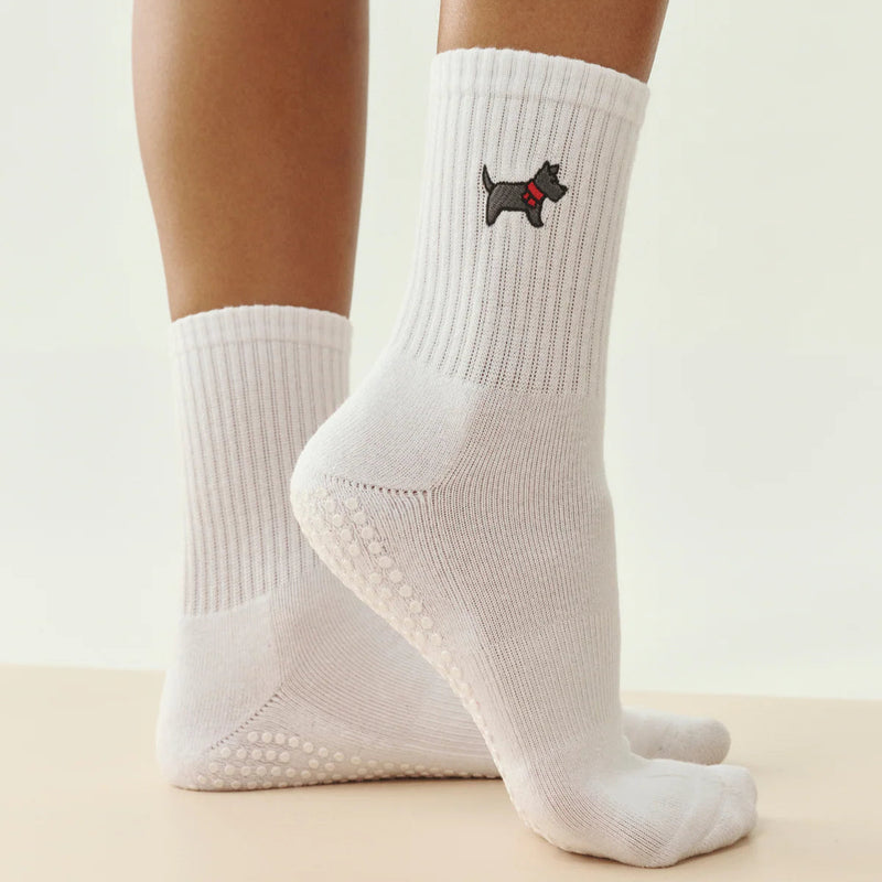 White socks with a dog design on a neutral background