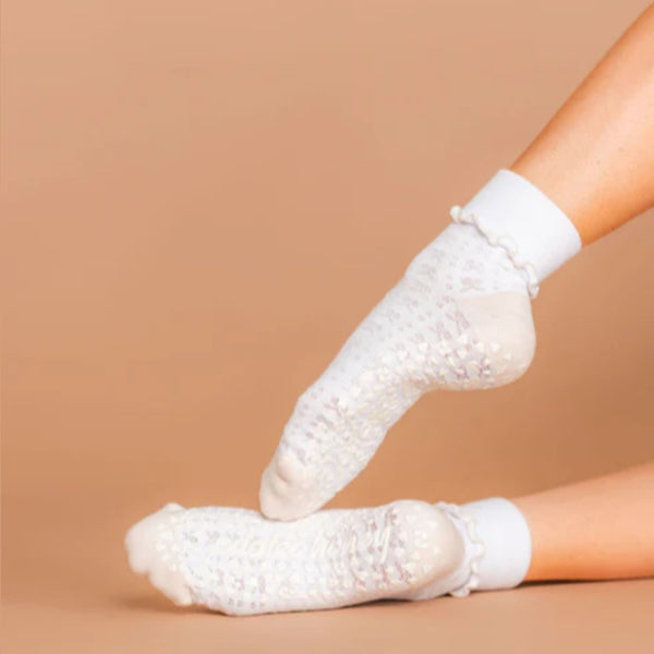 white ruffle grip socks with bows pattern
