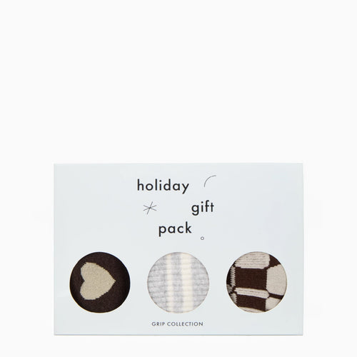 Holiday gift pack with three socks on a white background