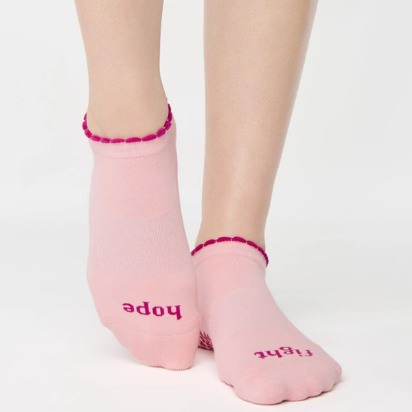 Pink socks with text on a white background