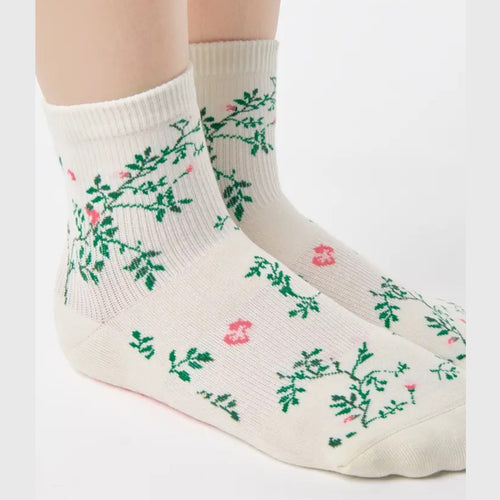 White socks with floral patterns on a white background