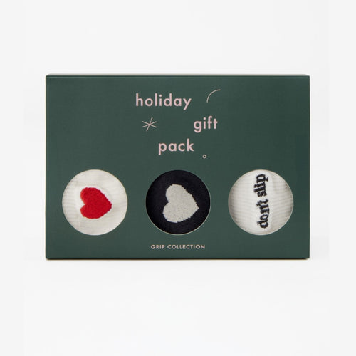 Holiday gift pack with three small balls on a green card