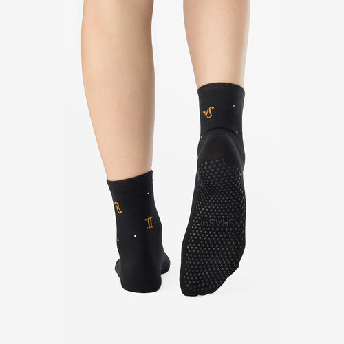 Black socks with gold symbols on a white background