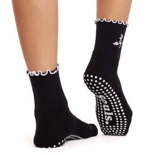 Black socks with white polka dots and text on a white background
