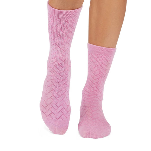 Pink textured socks on a white background