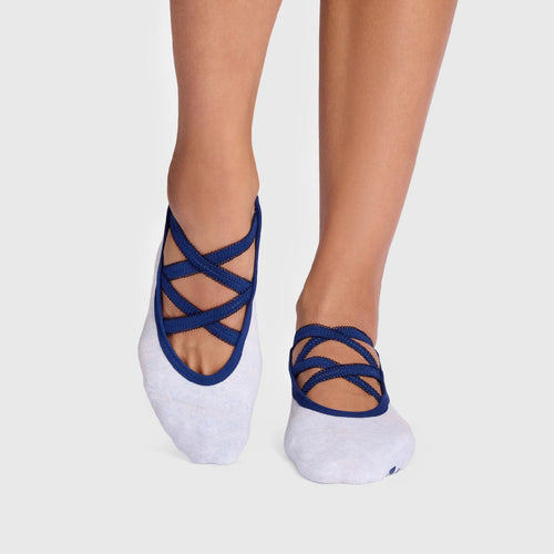 White socks with blue criss-cross design on a light gray background