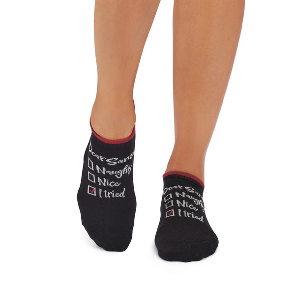 Black socks with text worn by a person on a white background